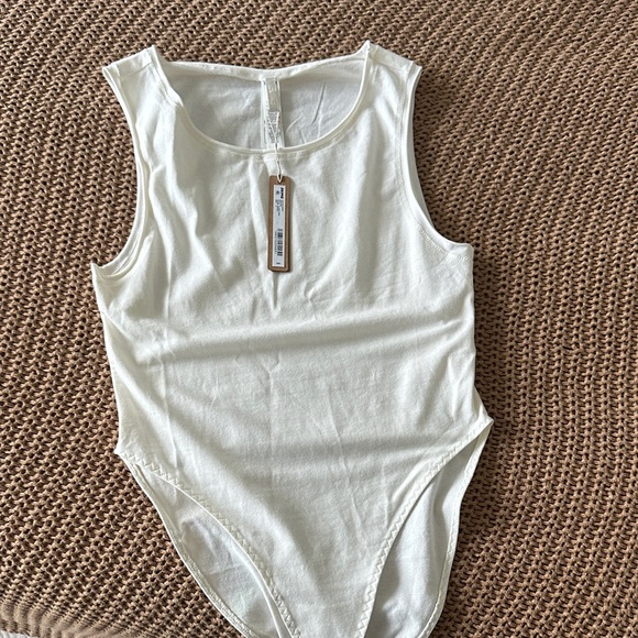 SKIMS Tops - SKIMS Cream Sleeveless Bodysuit